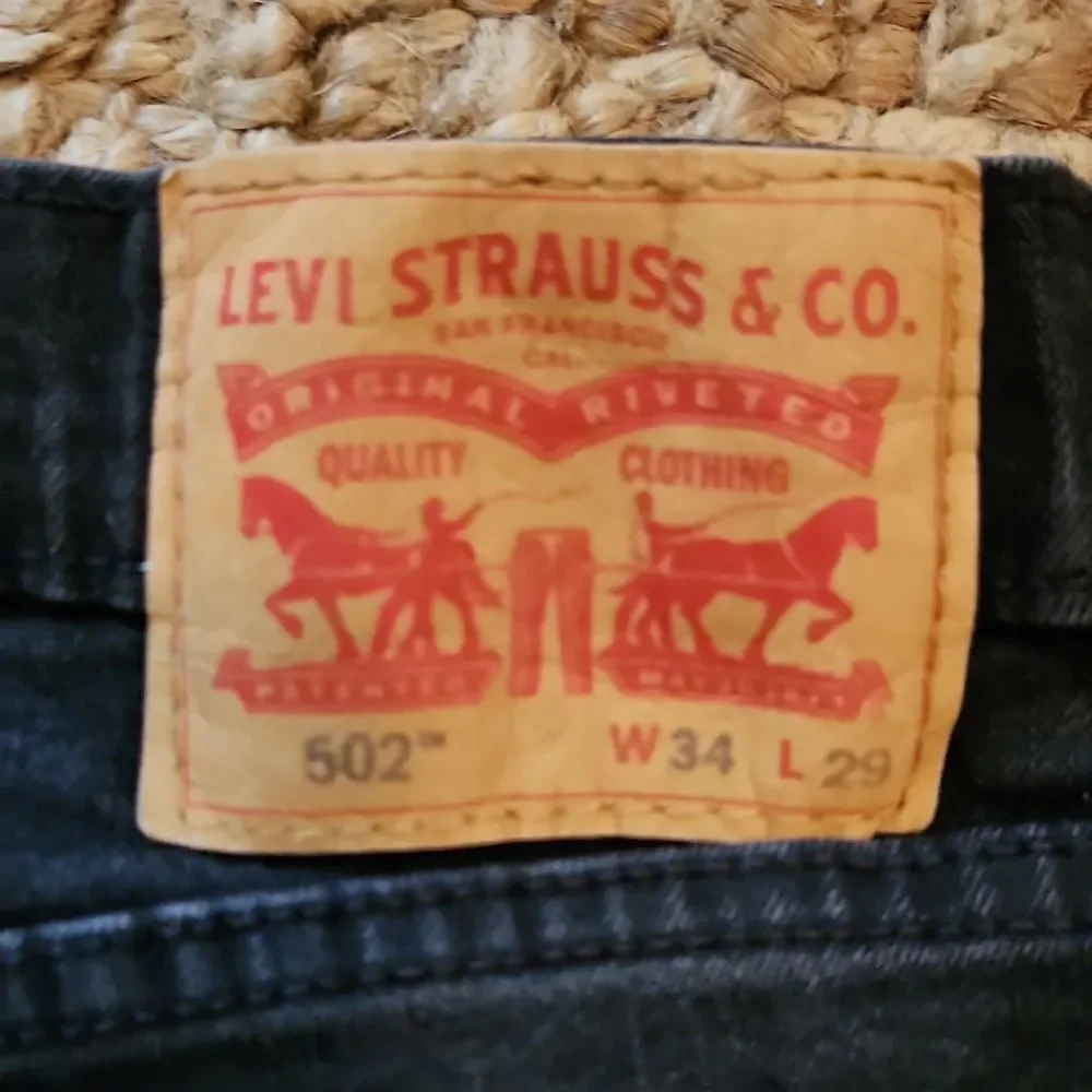 Levi 502 Black Denim Jeans 34×27